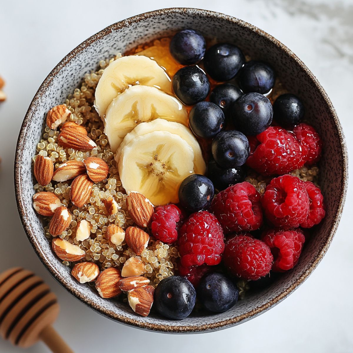 Homemade Quinoa Breakfast Bowl Recipe topped with fresh fruits and nuts