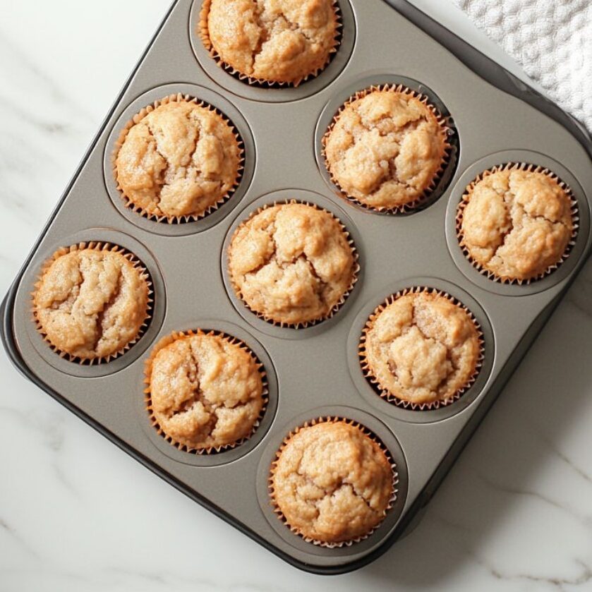 Baked muffins in the oven or just removed, golden on top