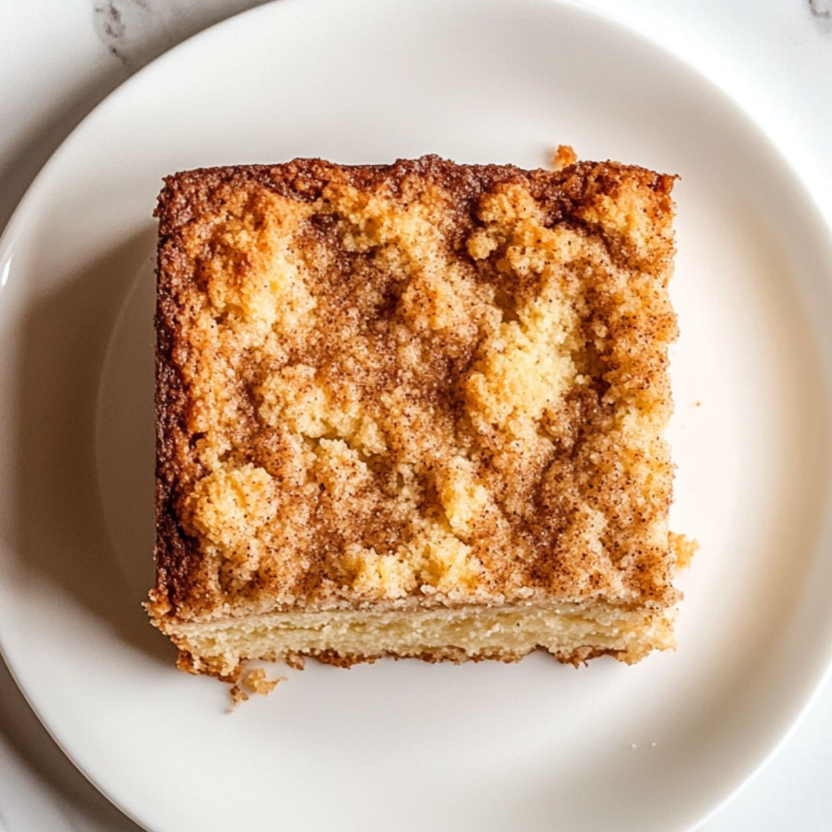 Homemade coffee cake recipe with a crumb topping and a slice served with coffee