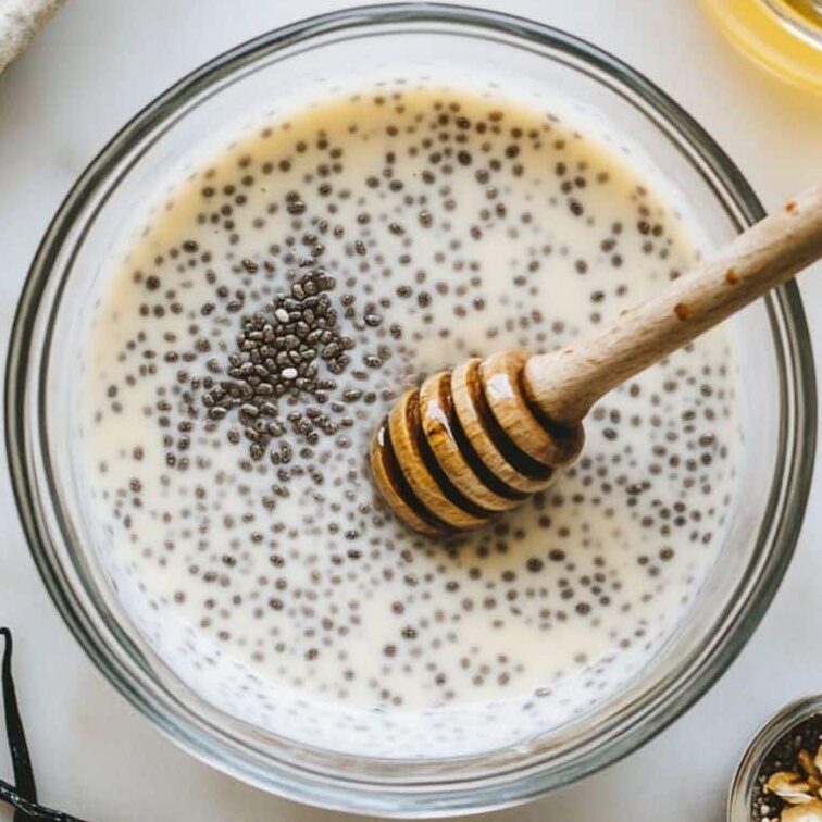 Chia pudding resting in a jar after the first stir
