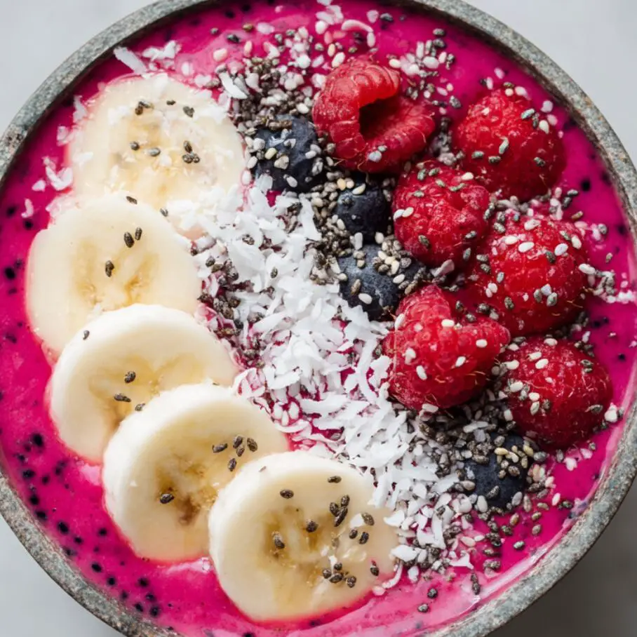 Pouring smoothie into bowl with toppings ready to be added