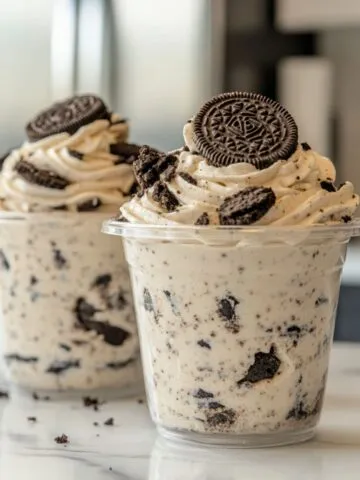 Oreo Pudding Recipe dessert served in a clear dish with visible creamy layers and crushed Oreos.