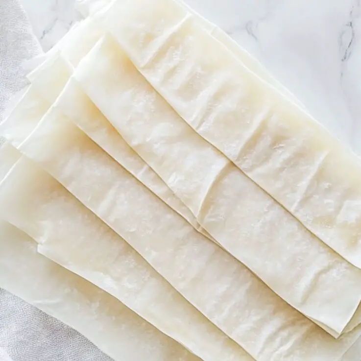 Phyllo sheets cut into long strips, covered with a towel