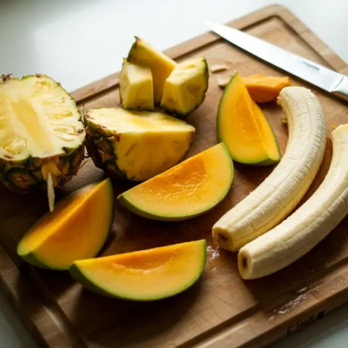 Chopped tropical fruits on a cutting board