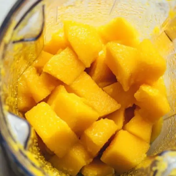 Blended mango puree and bloomed gelatin ready for mango pudding layer.