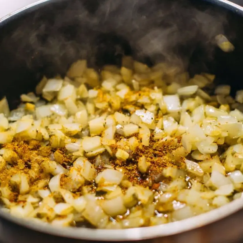 Onions and garlic sautéing with Lebanese spices
