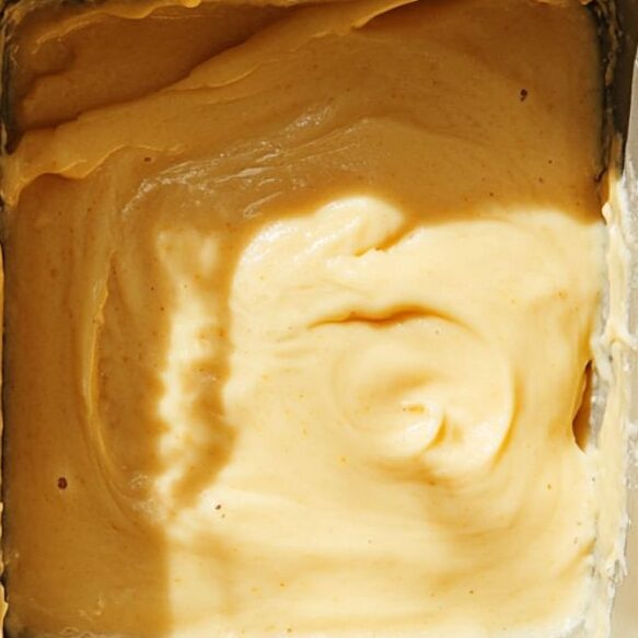 Citrus cake batter in a rectangular baking dish ready for the oven