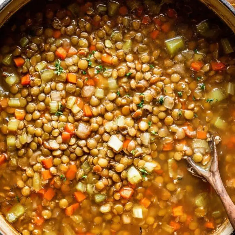 Red lentil soup simmering on stovetop