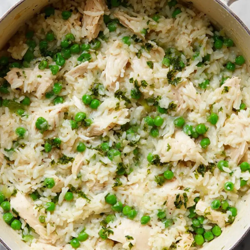 Peas and butter folded into finished chicken and rice