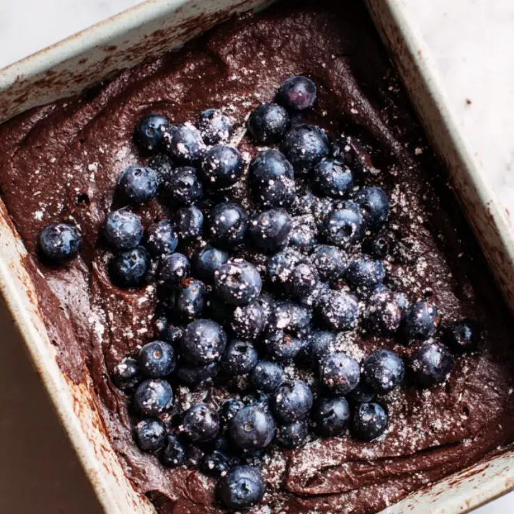Brownie batter with blueberries ready to go into the oven

