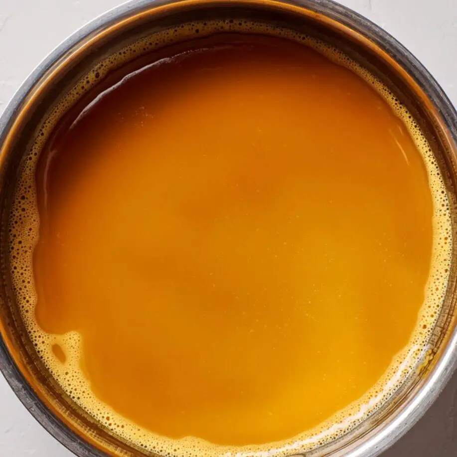 Caramel being poured into flan mold