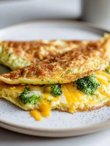 Close-up of homemade broccoli cheddar omelette recipe on a plate.