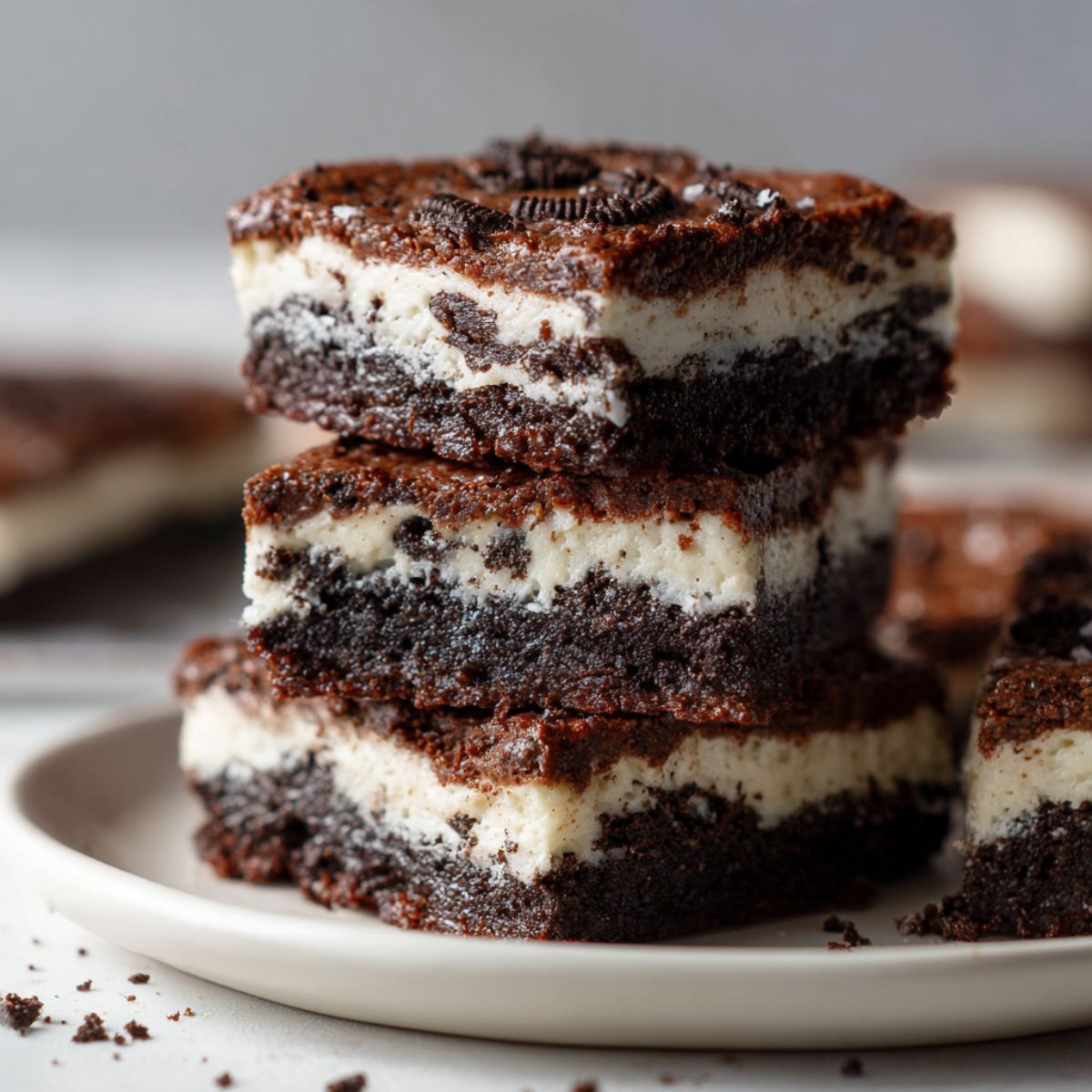 Close-up of a stack of Oreo cookie bars recipe on a white countertop