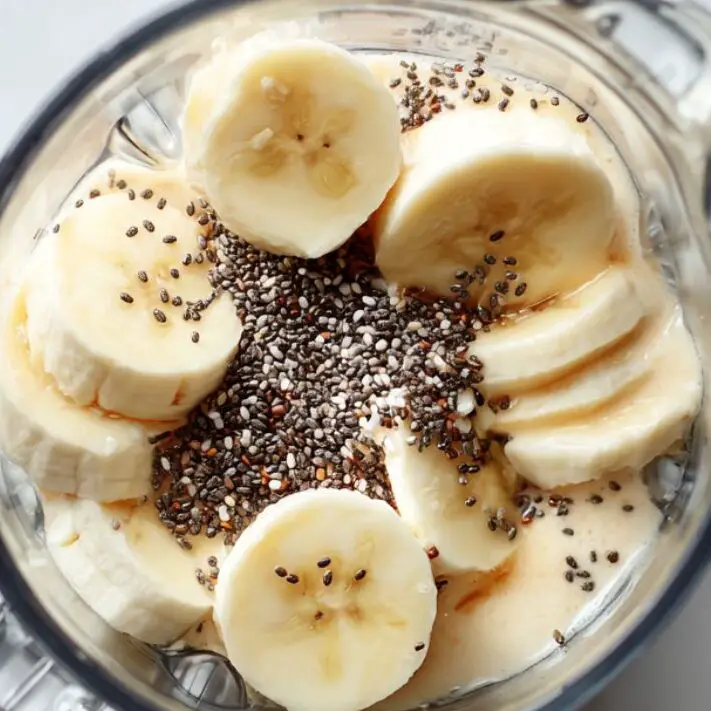 Ingredients added to blender for banana coffee smoothie