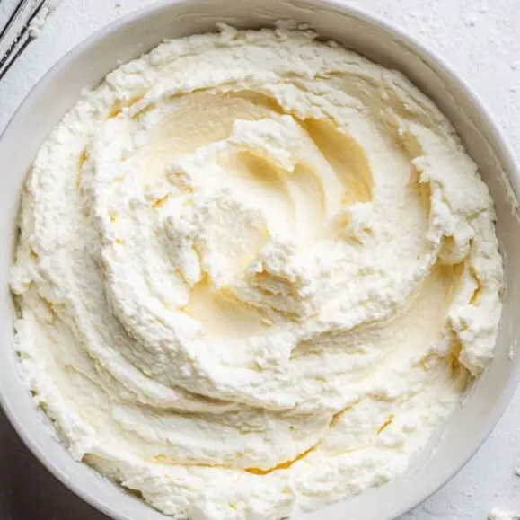 Fresh ricotta whipped in a bowl ready to spread