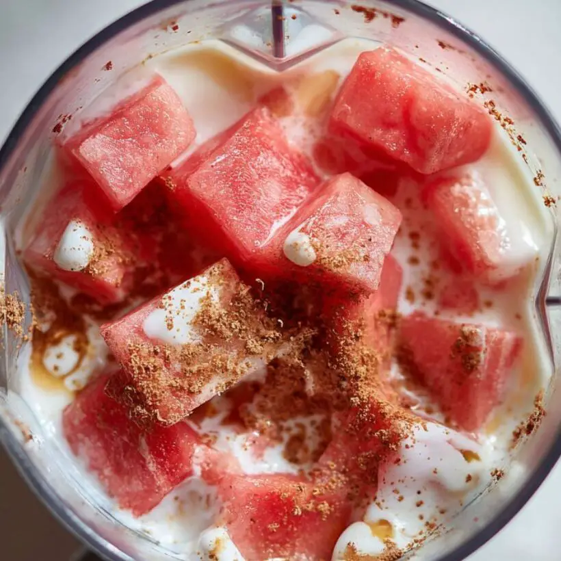 Blender with guava, yogurt, and milk ready for blending

