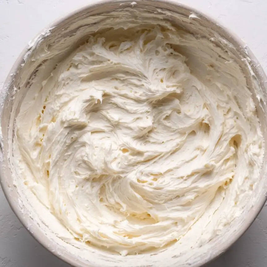 Cream cheese layer whipped until fluffy in a mixing bowl