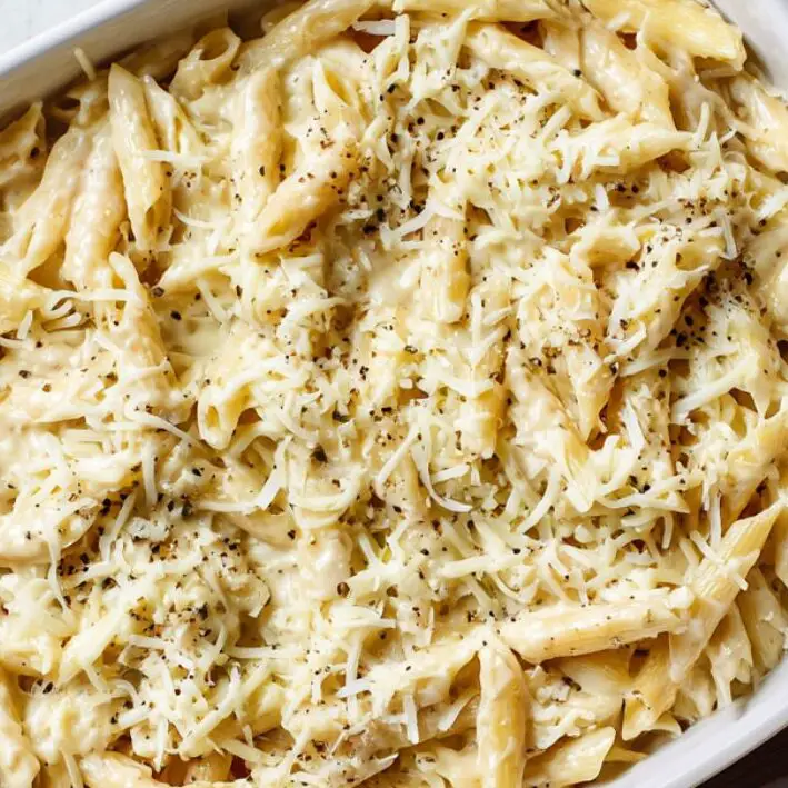 Four cheese pasta mixture in baking dish ready for oven