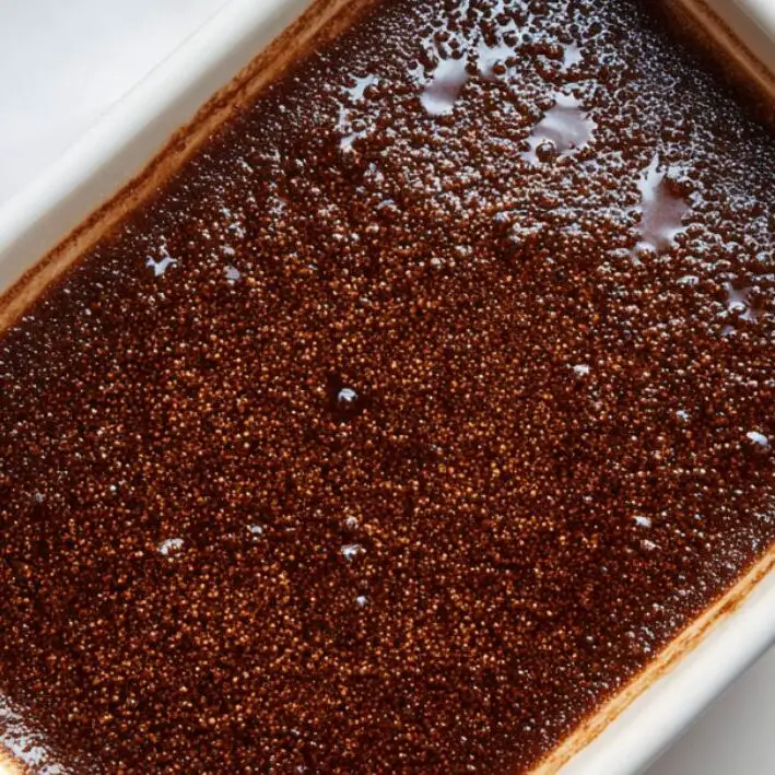 Hot water sitting on top of cake batter in baking dish