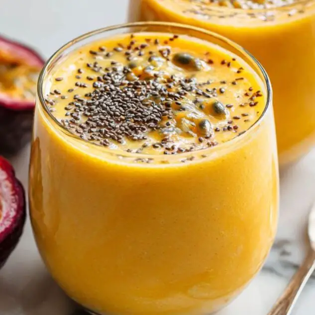 Passionfruit smoothies served in glasses with chia and fruit garnish