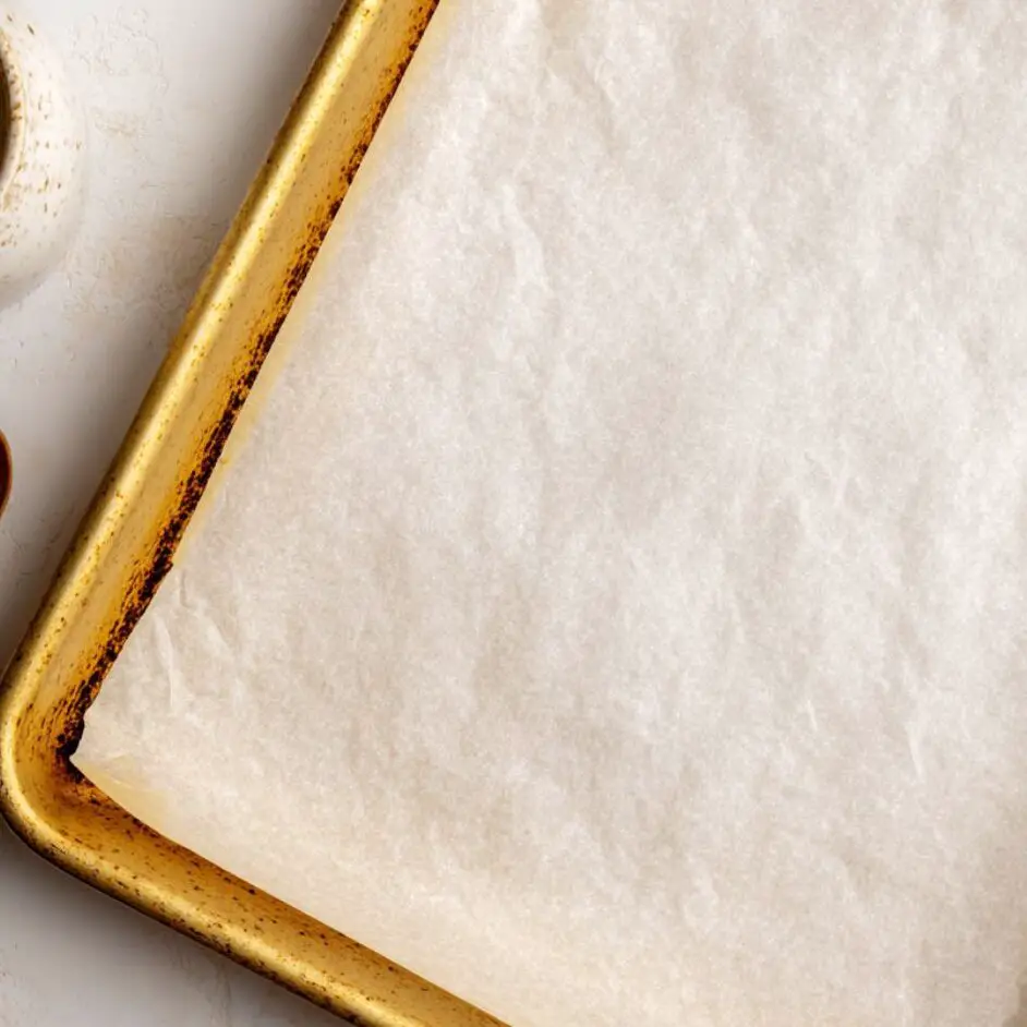 Baking sheets, butter, and measuring tools prepared on a counter for Swedish cookies

