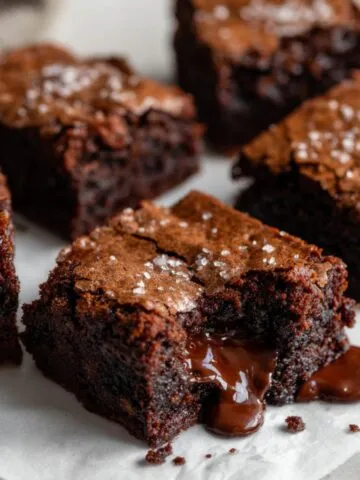 Homemade chocolate lava brownies recipe on a white marble counter with gooey molten centers, photographed from above in a natural homemade style.