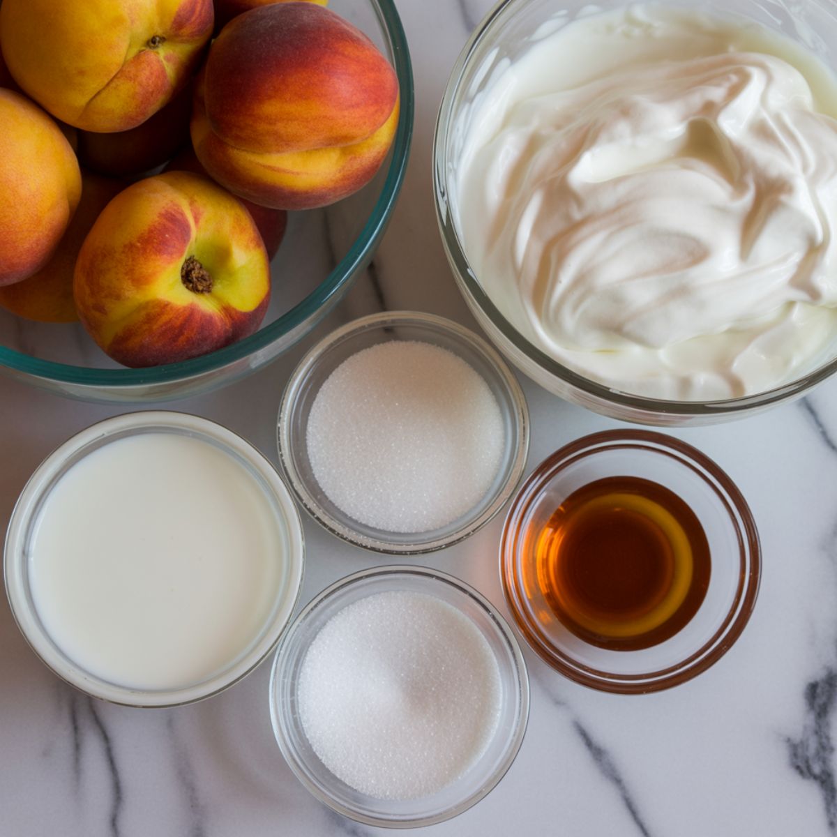 Fresh peaches, cream, milk, sugar, and vanilla on a white marble counter