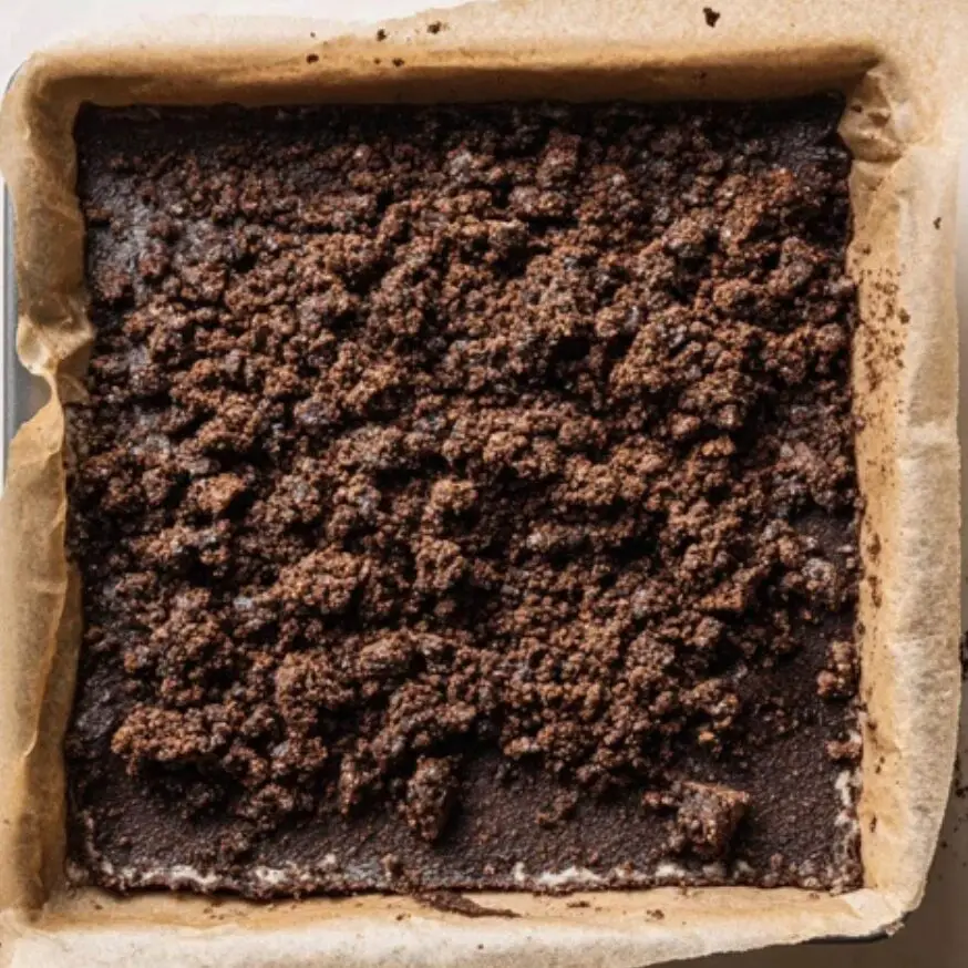 Chocolate fig bars assembled in baking pan before baking