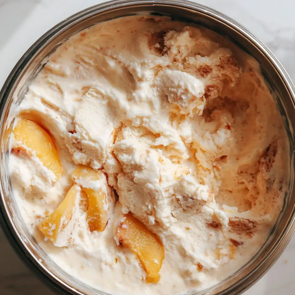 Peach ice cream churning in an ice cream maker