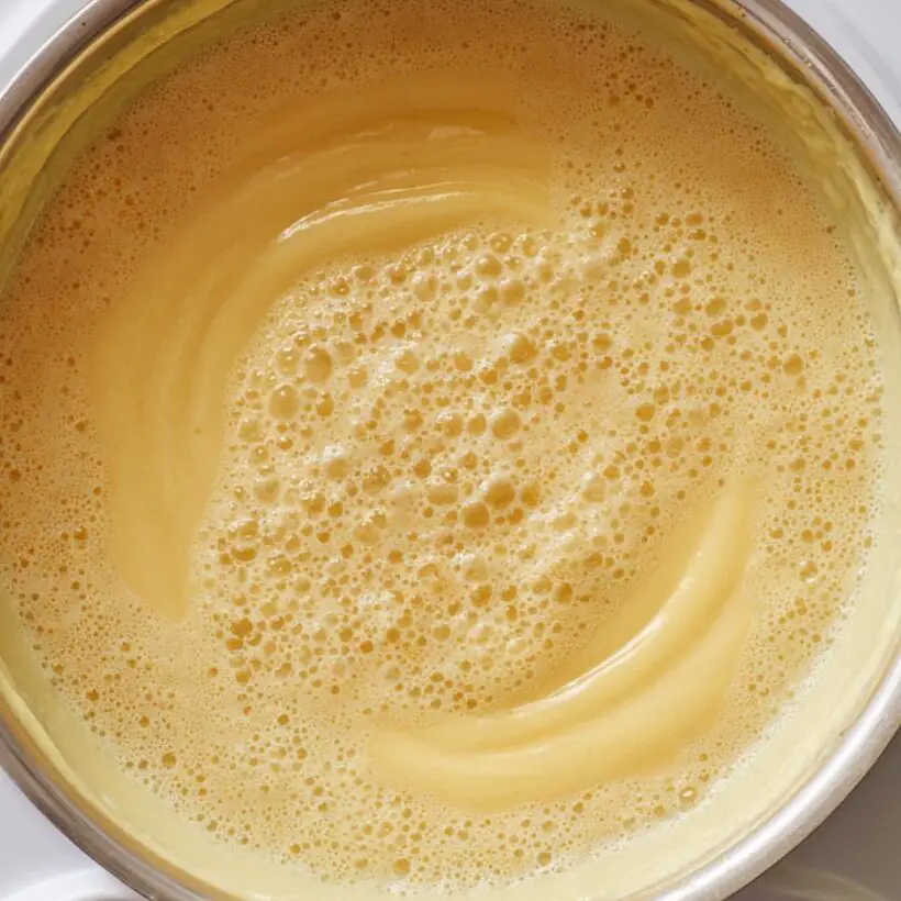 Cooking and thickening pudding mixture on stovetop

