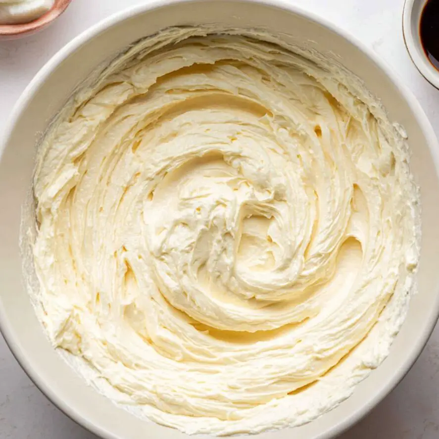 Homemade mascarpone filling being mixed for tiramisu cookies

