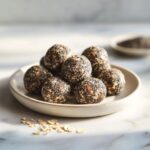“Homemade chia seed energy bites recipe on a white marble counter, shot from above with natural light for a real kitchen feel.”